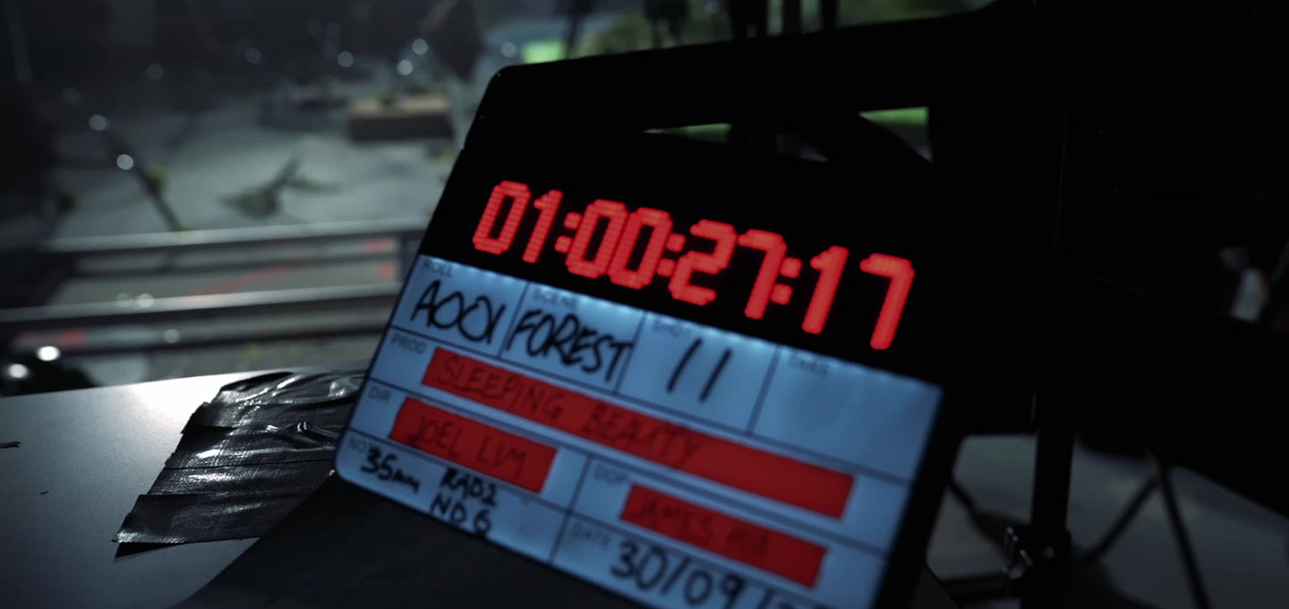 Sleeping Beauty clapperboard in foreground with a virtual forest environment on the LED wall behind