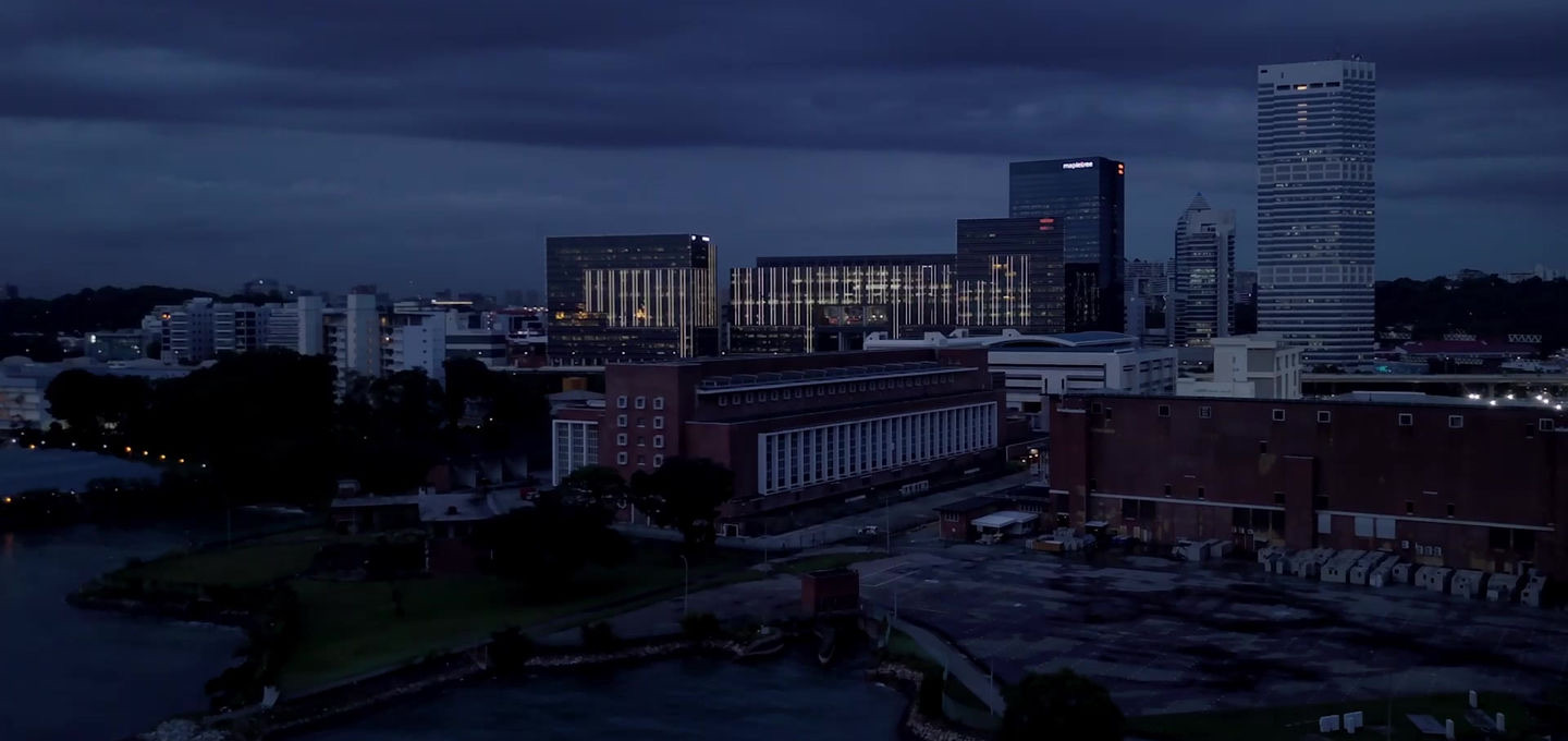 Aerial dusk view of the heritage power station building on the Singapore waterfront